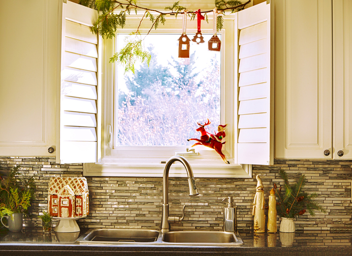 Kitchen window with Christmas decoration. Interior kitchen with Christmas decoration.