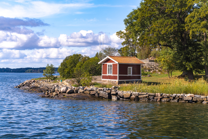 Wooden hut in traditional red at the Archipelago near Stockholm, Sweden