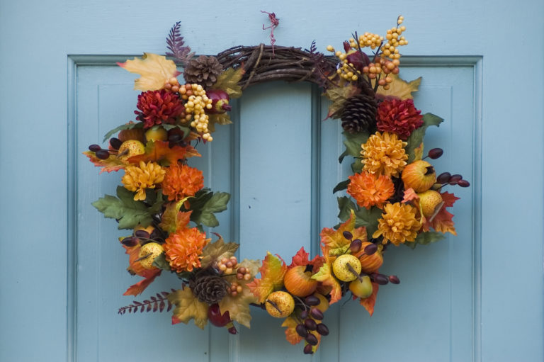 Thanksgiving wreath hanging on residential door