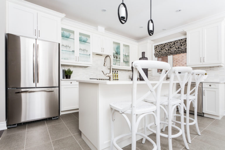 Home intereior kitchen painted in white, brightly lit