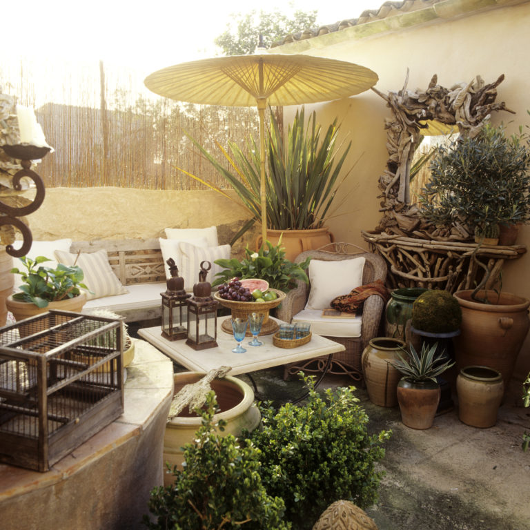 Mallorcan terrace furnished with Indonesian and rattan furniture